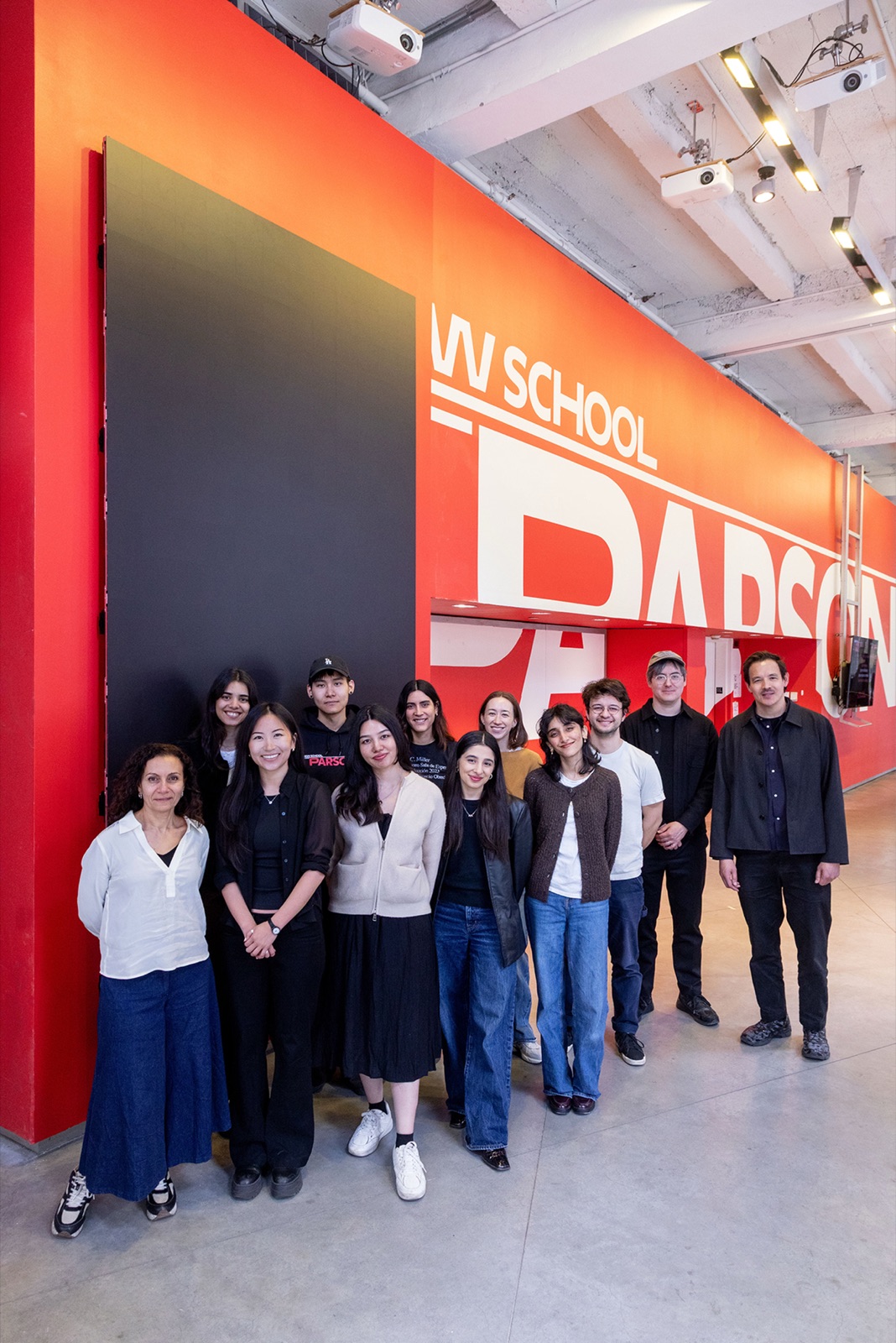 The Digital Expression Fellowship cohort in front of the Parsons wall